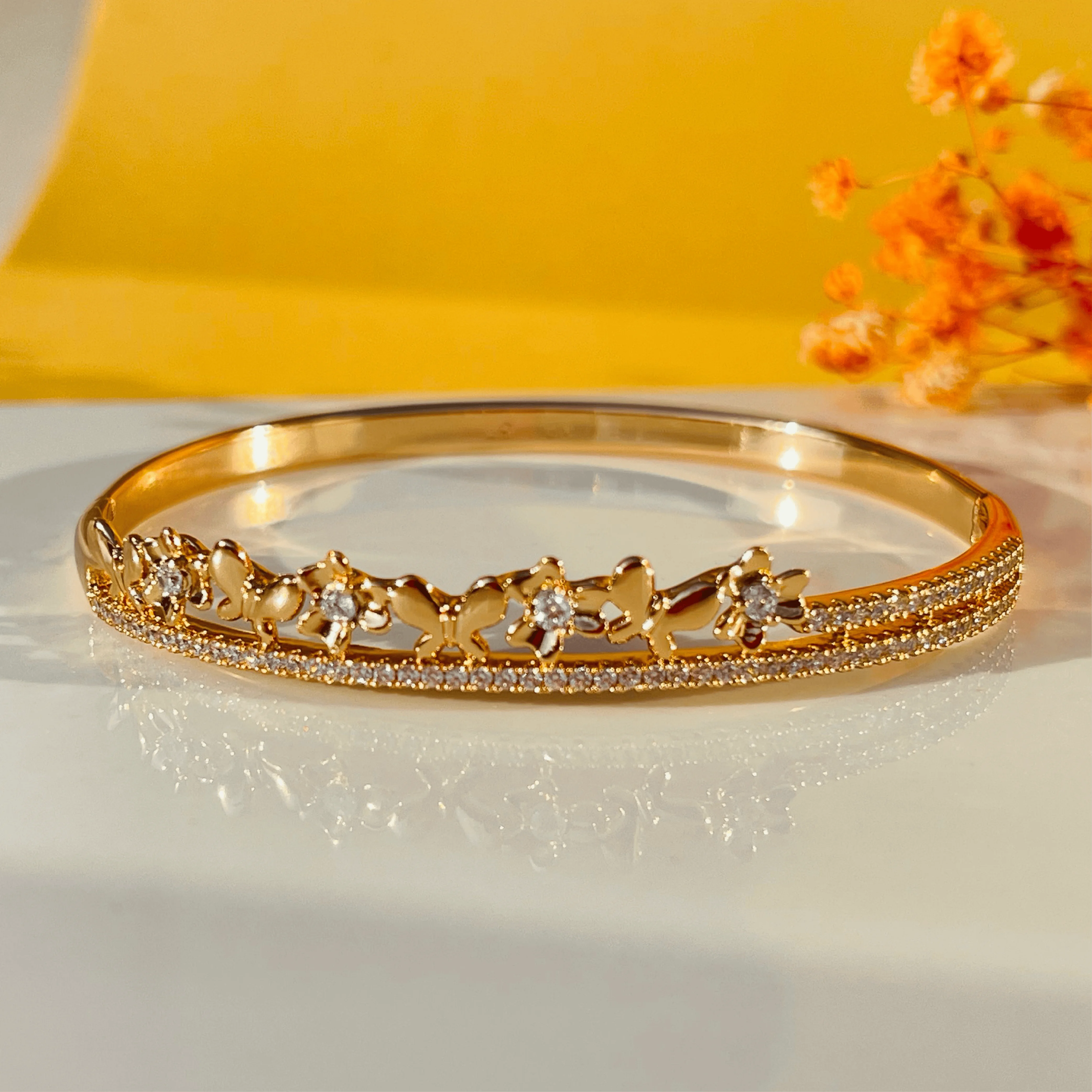 Butterfly Bloom Gold Bangles with White Stone Links