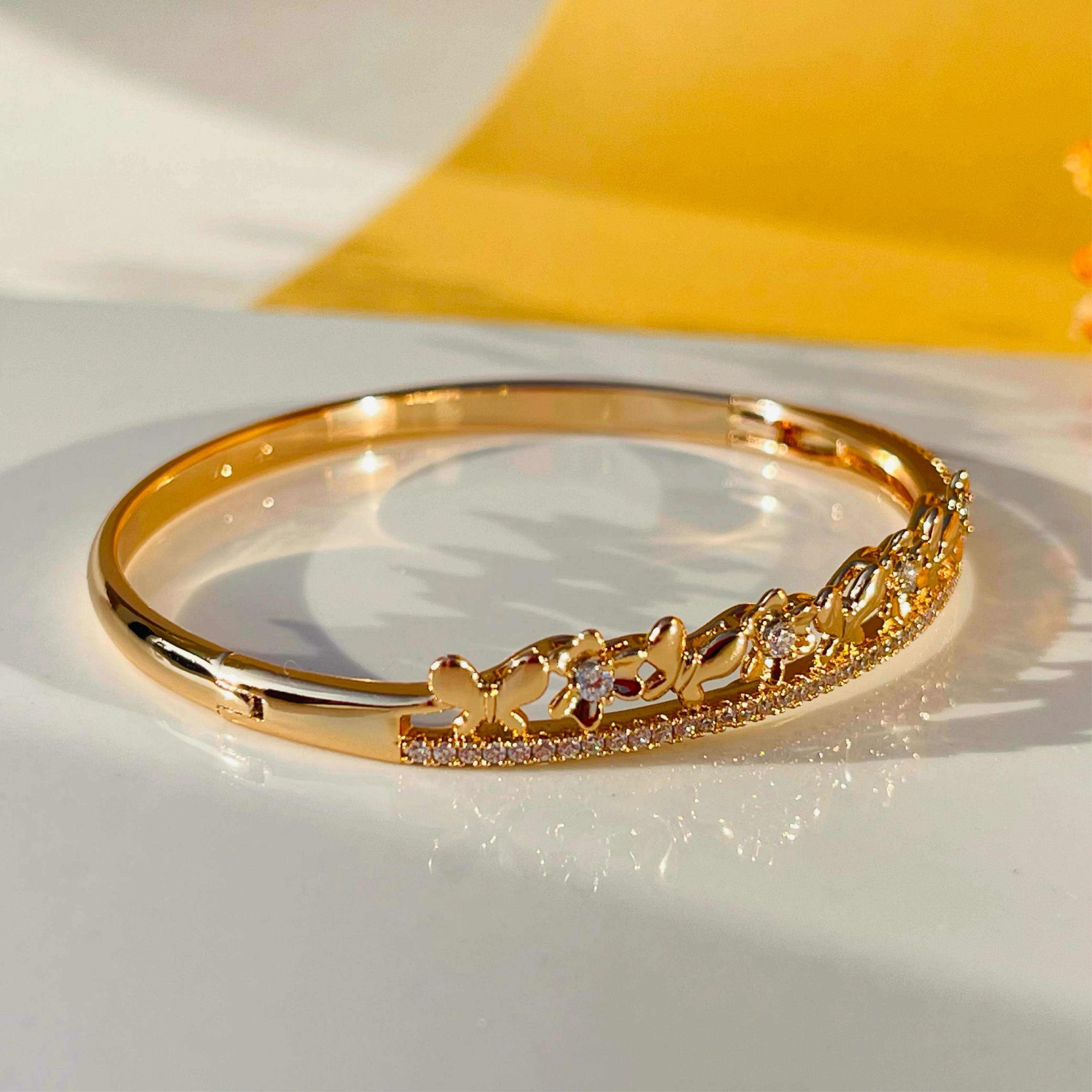 Butterfly Bloom Gold Bangles with White Stone Links