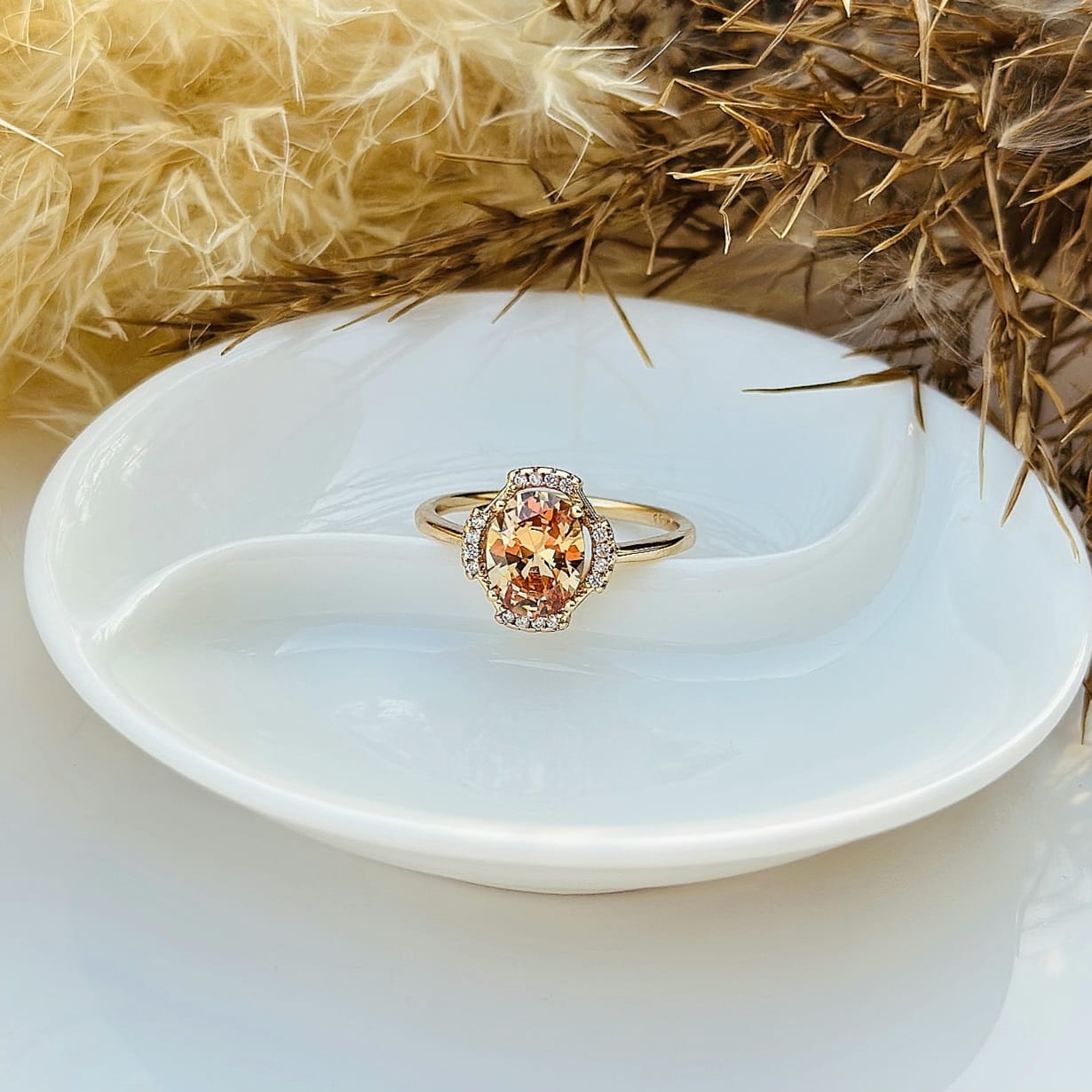 The Amber Glow Oval Halo Ring