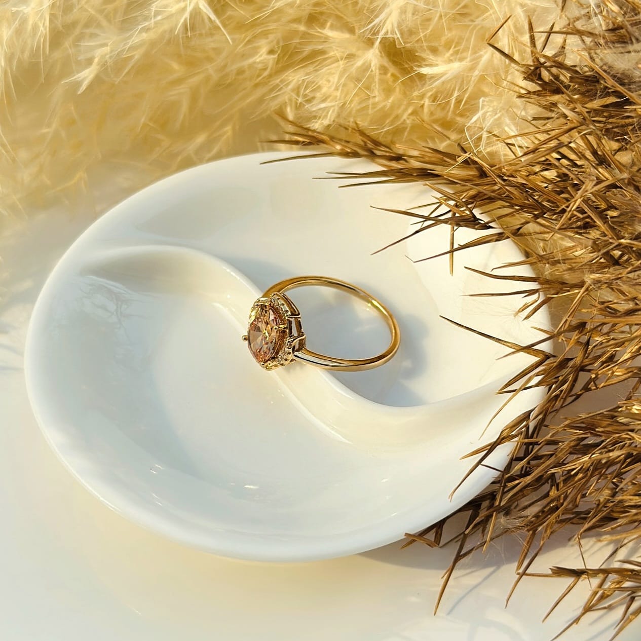 The Amber Glow Oval Halo Ring