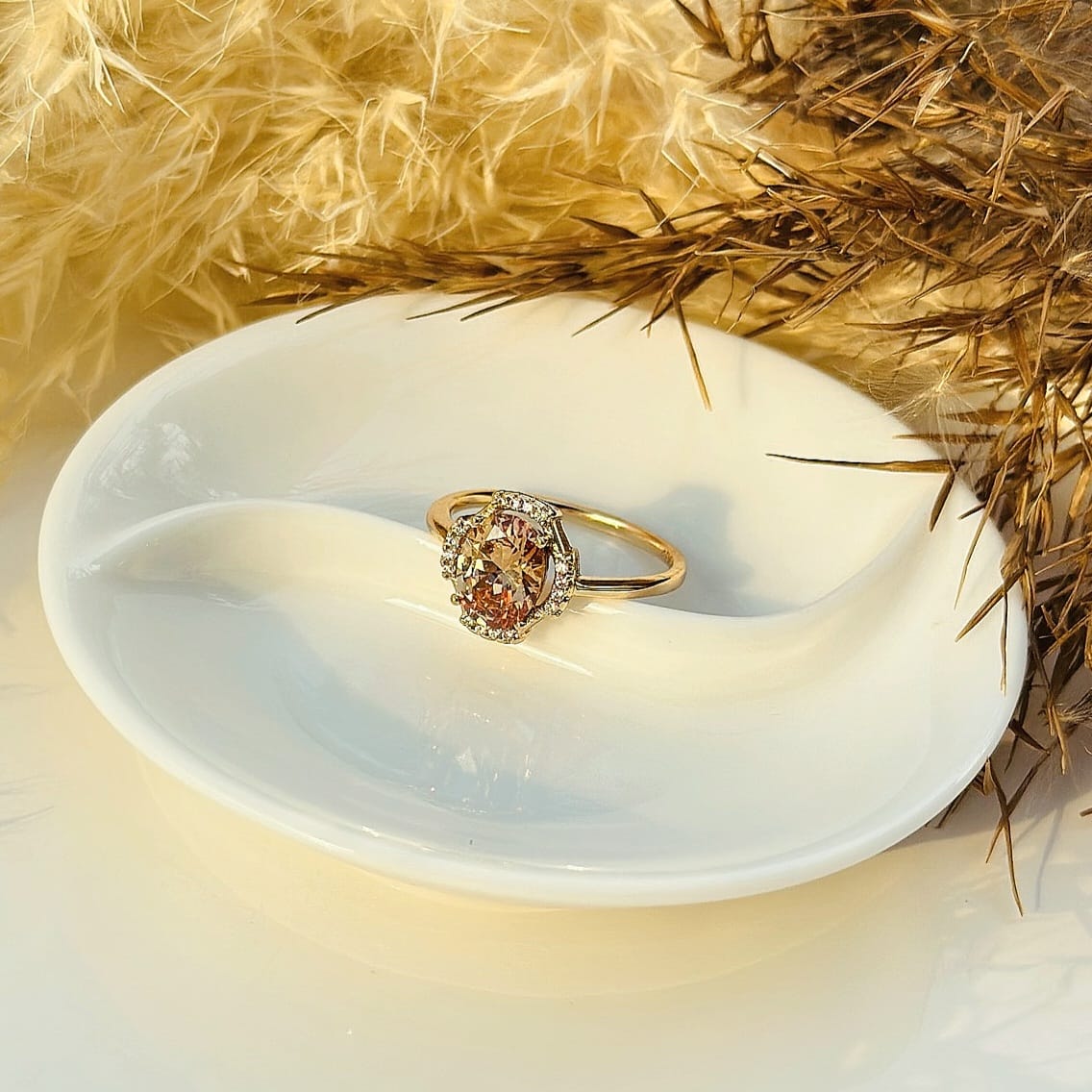 The Amber Glow Oval Halo Ring